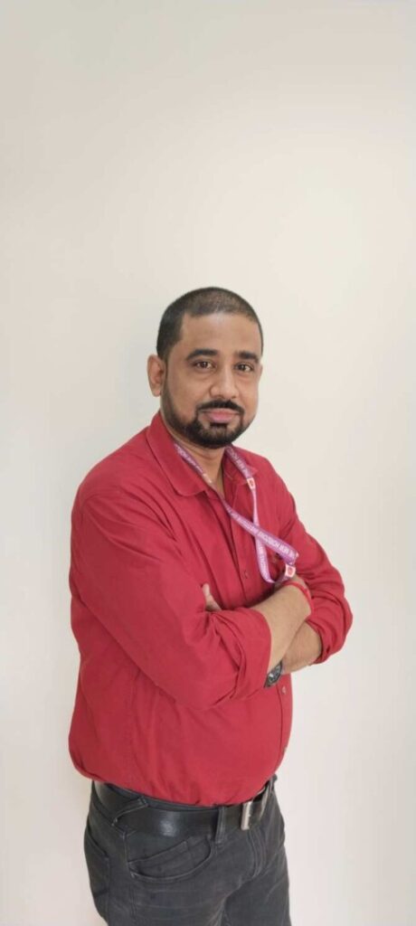 Man in red shirt with arms crossed