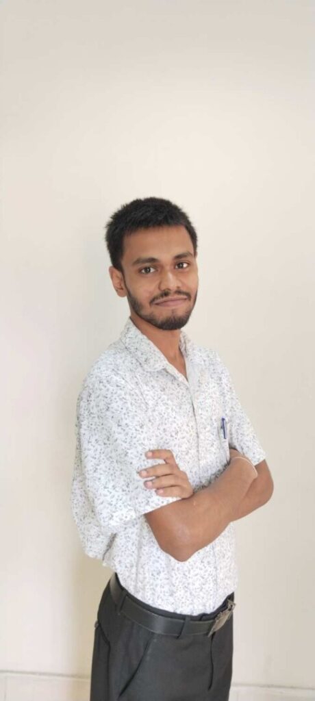 Man in a white shirt smiling