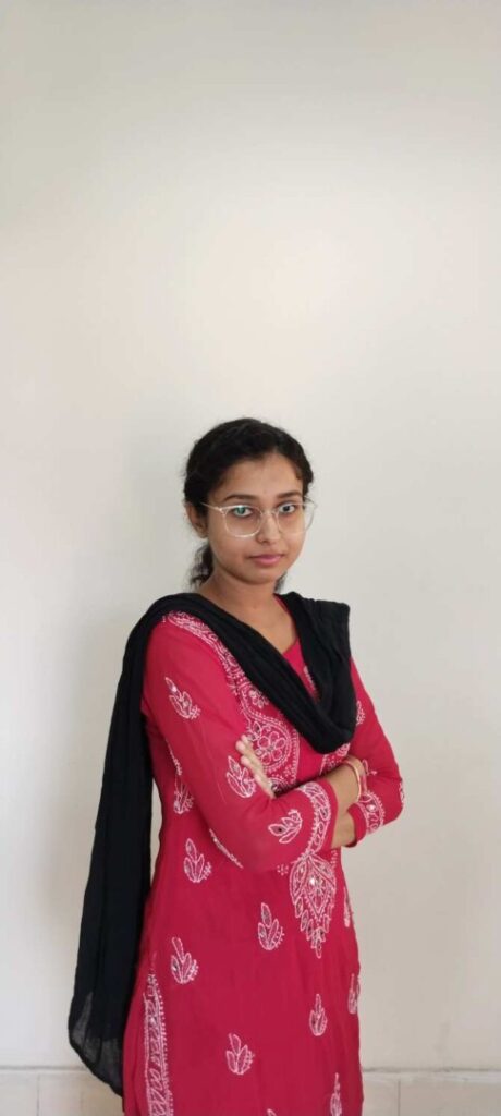 Woman in red dress with black scarf
