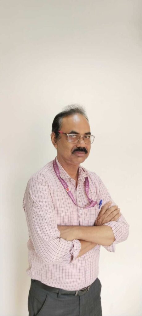 Man in checkered shirt with folded arms