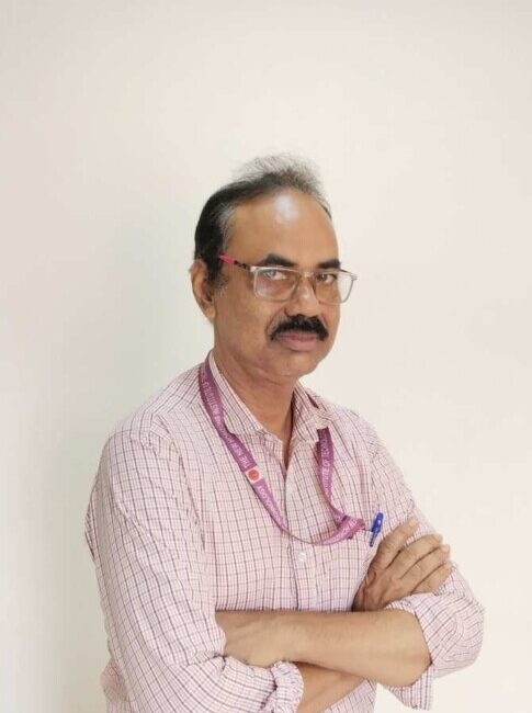 Man in checkered shirt with folded arms